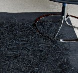 Paper in black. Rug handwaeved in paper. Design Elisabeth Johansson