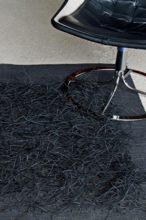 Paper in black. Rug handwaeved in paper. Design Elisabeth Johansson